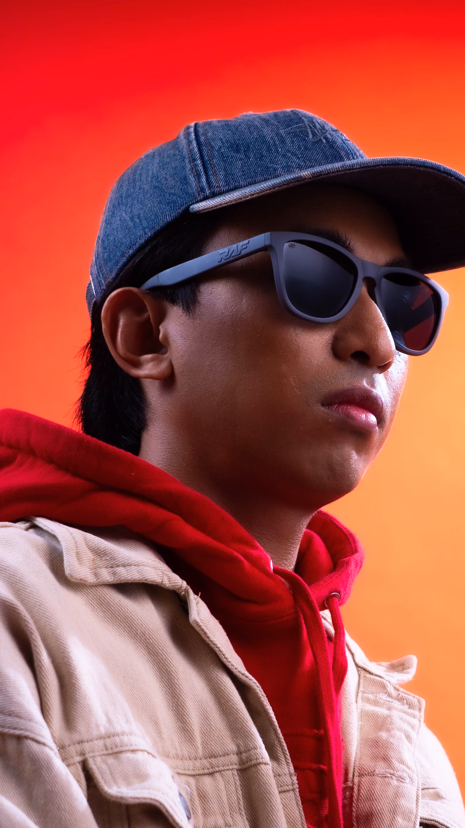 RAF Prime worn — cap red hoodie look from the 2026 campaign